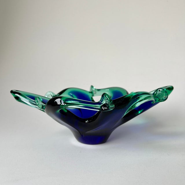 This mid-century Murano glass bowl is attributed to the manufacturer Crystal Clear via an original paper label on the...