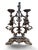 A substantial patinated cast iron candelabra with two lights, resting on a rocaille-decorated base. The central shaft,...