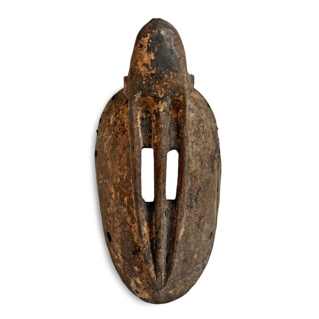 Vintage Dogon monkey mask from Mali. This piece embodies the abstraction and spiritual symbolism characteristic of...