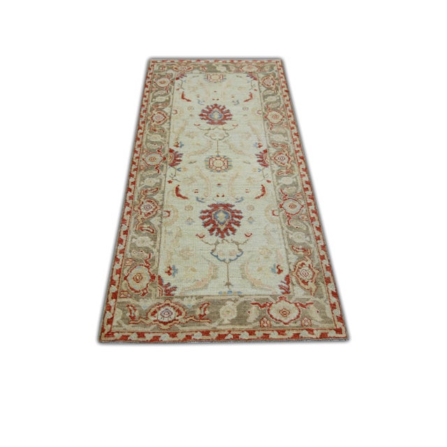 Turkish Oushak Rug Cream & Brick Red Handwoven Wool Runner 2'8" x 6'2" This Turkish Oushak runner is crafted from...