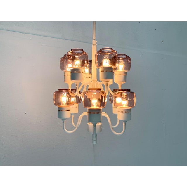 Rare candlestick from Hans-Agne Jakobsson from the 1960s. Here in a rare version in white with transparent purple glasses....