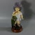 Brownfield Majolica figure which features a young child wearing a grown ups hat and shoes, carrying an umbrella. Title,...