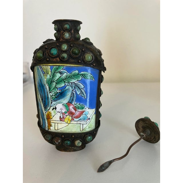 Beautiful hand painted glass and bronze vintage Chinese snuff bottle. Lovely shades of blue, green, yellow and red adorn...