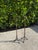 Striking pair of tall vintage iron candlesticks with sculptural forms, slender stems, stacked ring details, and...