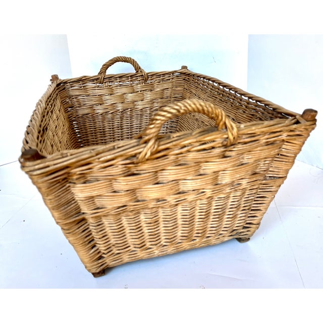 Imported from Germany. Vintage European wicker market basket with interlocked braided edge, wood slat supports, and...