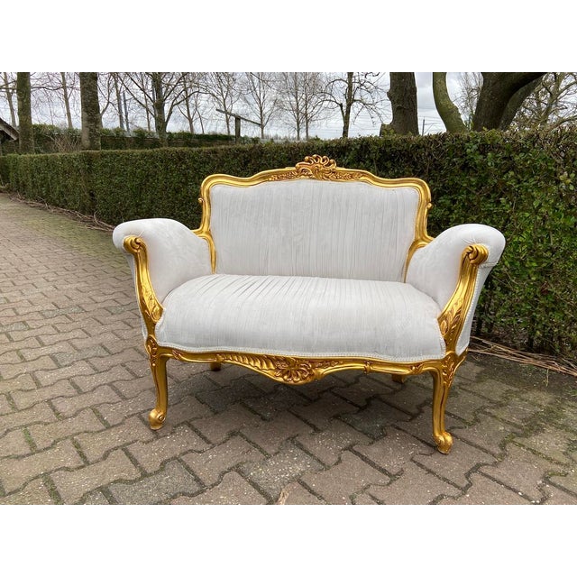 Late 20th Century French Louis XVI–Style Settee Off-White Velvet Upholstery with Gilt Beechwood Frame This elegant single...