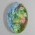 A 19th century French Barbotine Majolica wall platter with two pears hanging from a tree branch with green leaves and pink...