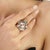 This Victorian-inspired statement ring is crafted in 925 sterling silver and features 128.4 carats of multicolor...
