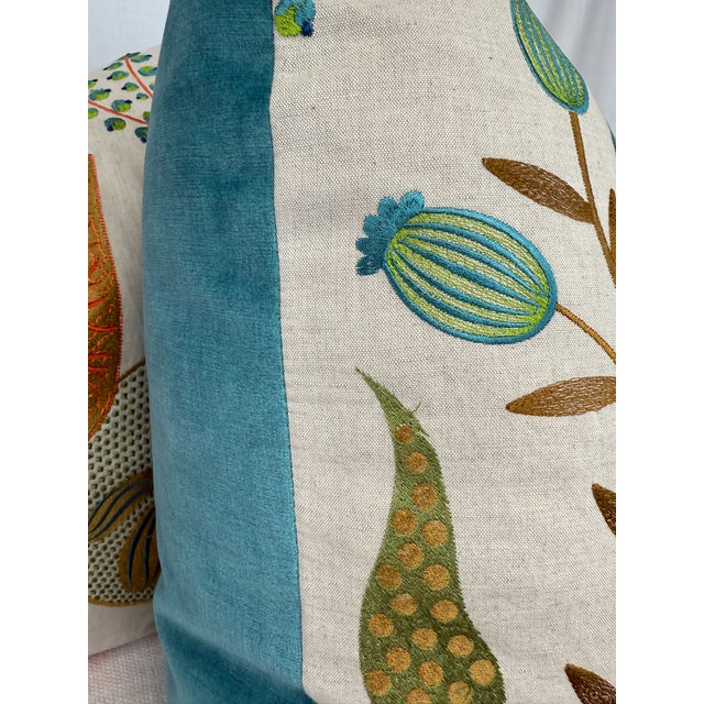 Custom pair of 22" pillows covered in a bright embroidered floral pattern on linen and backed in a coordinating aqua...