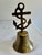 A vintage brass ship's bell finished with a nautical anchor and rope motif finial and banded ring detailing around the...
