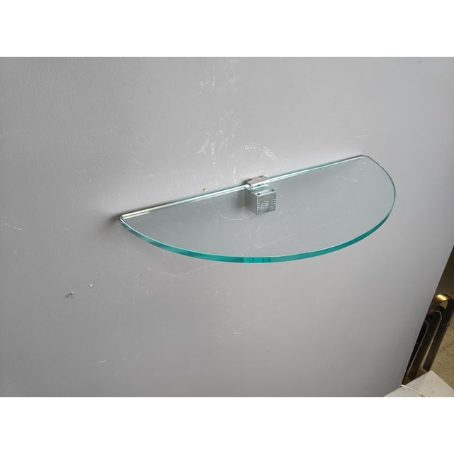 Rare vintage wall mounted shelf by Peter Ghyczy consisting of a chromed metal piece holding the glass plate. 1970s -...