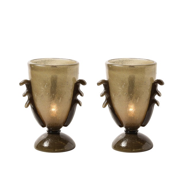 This elegant pair of Mid-Century Modernist uplights showcases the exquisite craftsmanship of Murano glass artisans,...