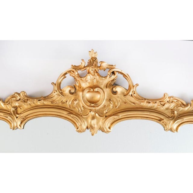 A superbly carved and highly decorative george iii revival giltwood mirror, dating from circa 1860. This stunning...