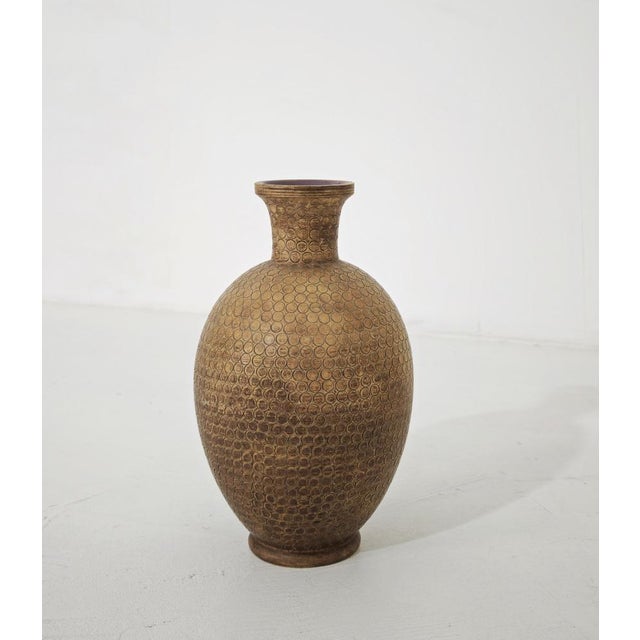 Ceramic vase by artist Zaccagnini. It stands out for its rich sculptural silhouette and distinctive honeycomb-like...