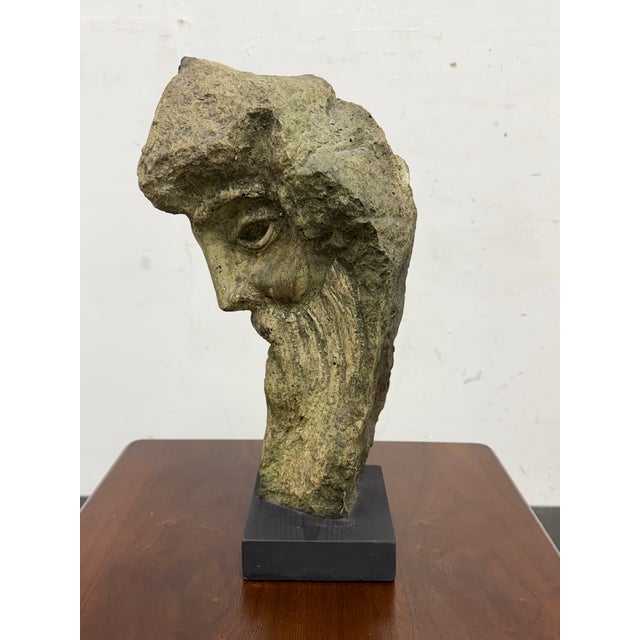 Design Plus Gallery presents a Resin Figural Head Sculpture. This expressive bust has a weathered stone like surface with...