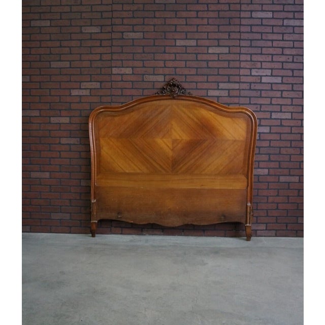 Lovely antique French Rococo full bed. Incredible diamond pattern veneer and sweet carved centerpiece. This bed will add a...
