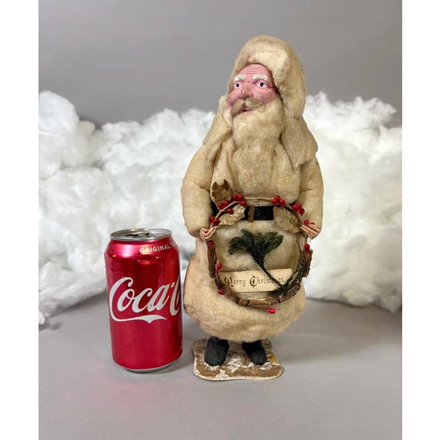 Antique German cotton batting Santa Claus figure made for the American export market, featuring an expressive hand-painted...