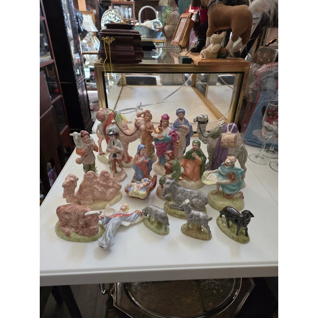 Beautiful hand painted and glazed Nativity set 19 pieces...as shown the set takes a space of 29" wide and 14" deep. The...