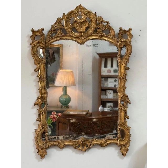 Outstanding Louis XV Mirror, c. 1750, carved giltwood with mirror borders. 46.25 h. x 31.25” w. x 2.50 d.