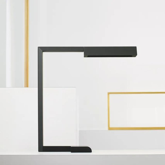 The Dessau 16 Table Lamp by Sean Lavin was inspired by the architecture, function and beauty of the Bauhaus movement with...