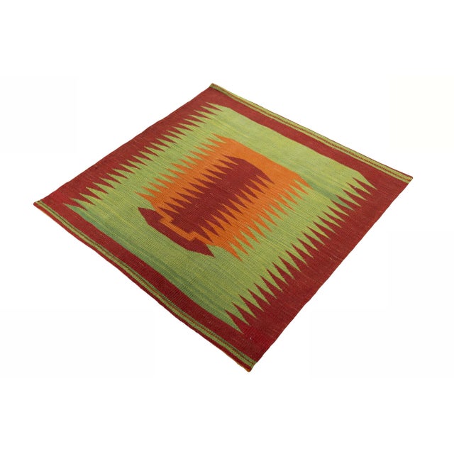 Discover the unique charm of our hand-woven designer kilim, which makes a strong visual statement at 99 x 97 cm. The...