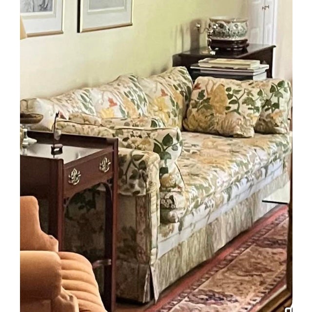 Elegant custom chinoiserie sofa featuring a beautifully detailed scenic floral upholstery with pagoda and botanical motifs...
