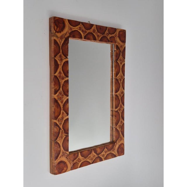 Mirror with handmade frame of end wood, Swedish 1970s. The wood creatives a beautiful, decorative pattern. In good...