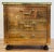 Vintage Sarreid, Ltd chest of drawers with a mirrored brass exterior and glass top. Features a polished finish with brass...