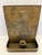 The highly collectible fireplace match holder is a quintessential piece of the late 19th-century British metalwork....