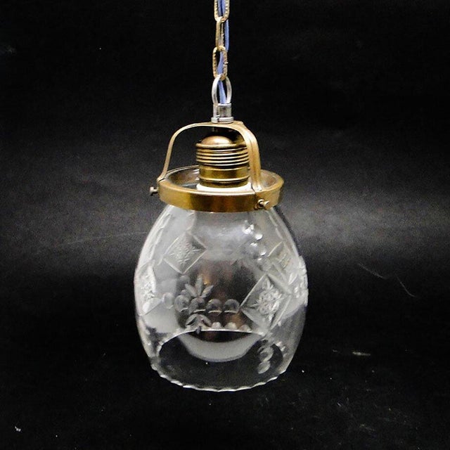 The pendant lamp was produced in the 50s. The construction is brass, glass lampshade. It is preserved in very good...