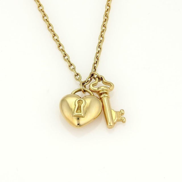 Contemporary Tiffany & Co.18k Yellow Gold Puff Heart Lock & Key Pendant Necklace For Sale - Image 3 of 9