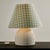 Table lamp with a woven-effect ceramic base and a textile lampshade from the 1980s. The ceramic base of the lamp is in...