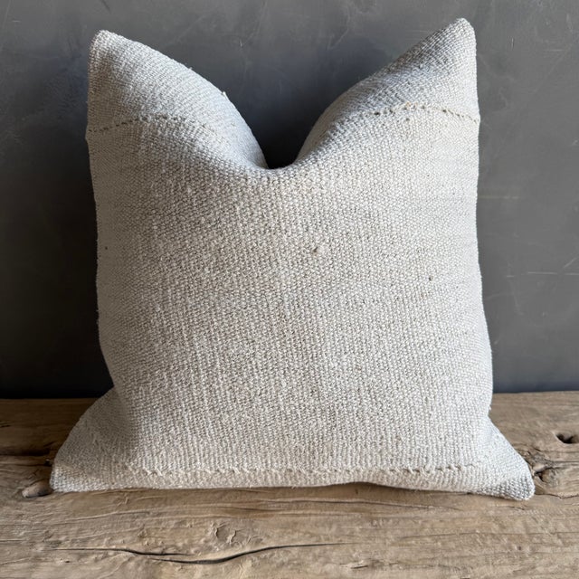 Creamy white hemp rug pillow. Soft hand, linen blend backing with zipper closure. Spot cleaning is recommended, or dry...