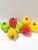 A playful set of seven vintage blown glass bell peppers in vivid red, yellow and green, each finished with an applied...