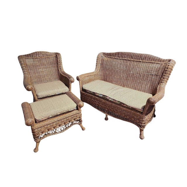 Gorgeous Victorian era wicker and rattan parlor suite, consisting of settee, chair, and ottoman, all in exellent...