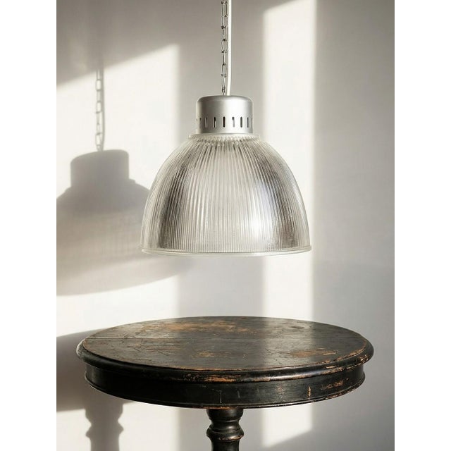Large industrial pendant light in prismatic glass, holophane type, by thorn, dated 1998, with a thick glass shade and...
