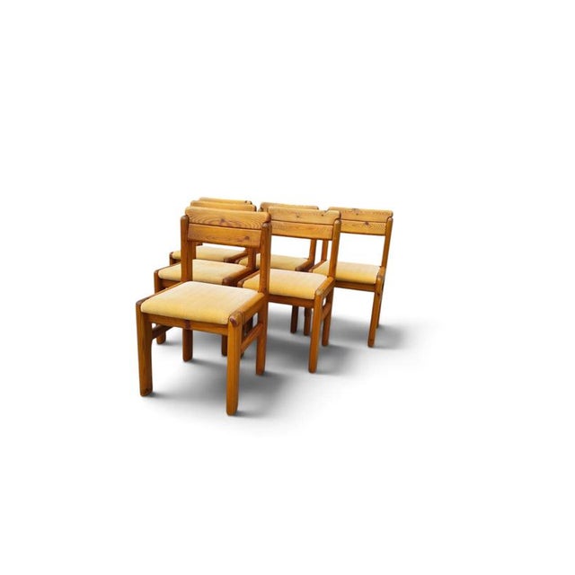 This set of French dining chairs from the 1970s brings a strong, architectural presence to the dining room. Crafted from...