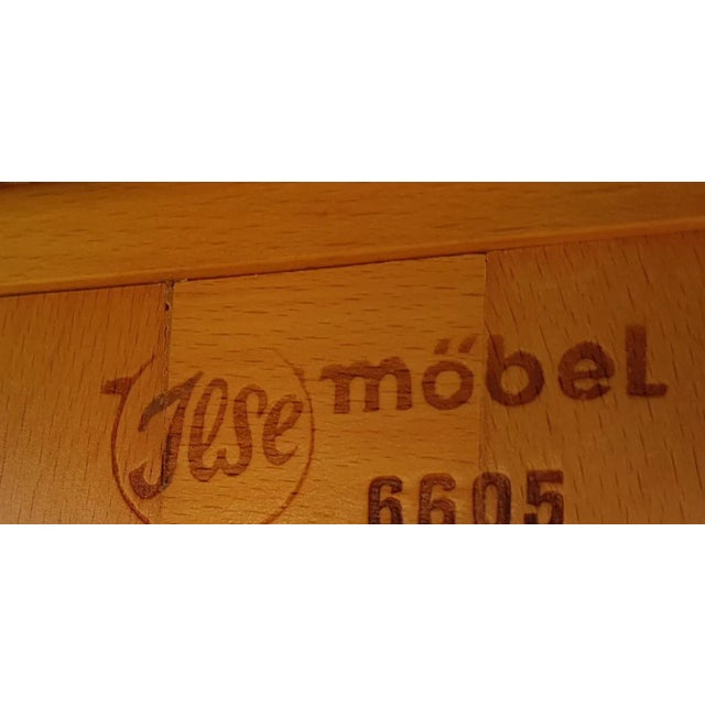 German Beech Magazine Rack from Ilse Möbel, 1950s, in Very Good conditions. Designed 1950 to 1959 This piece has an...