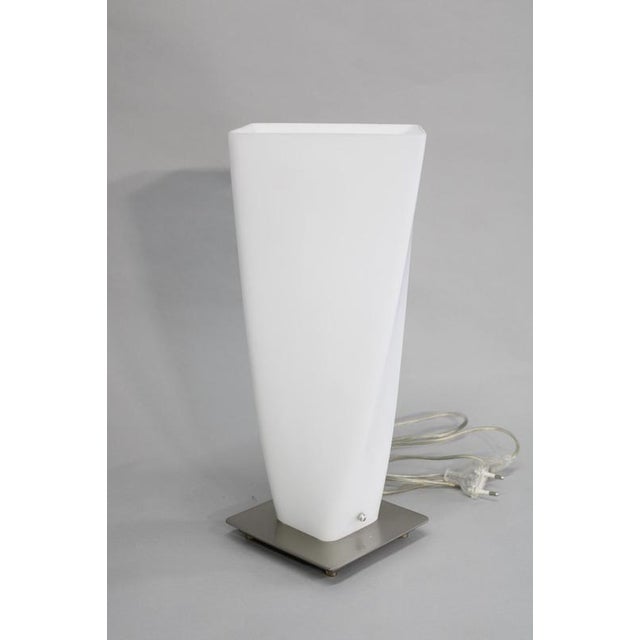 This italian contemporary table lamp dates from the circa 1990s and showcases the refined simplicity characteristic of...
