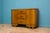 This high-quality goldon oak Art Deco sideboard, circa 1930s. Featuring two cupboards, each with shelves. There are also...