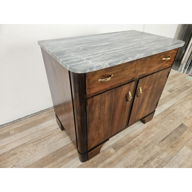 This small and elegant 1940s Art Deco sideboard is perfect for a variety of settings thanks to its compact size and...