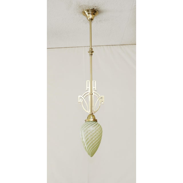 Art Nouveau Pendant Lamp Art Nouveau lamp made around 1910. Medallion-shaped brass mount in the Secession style. Very...
