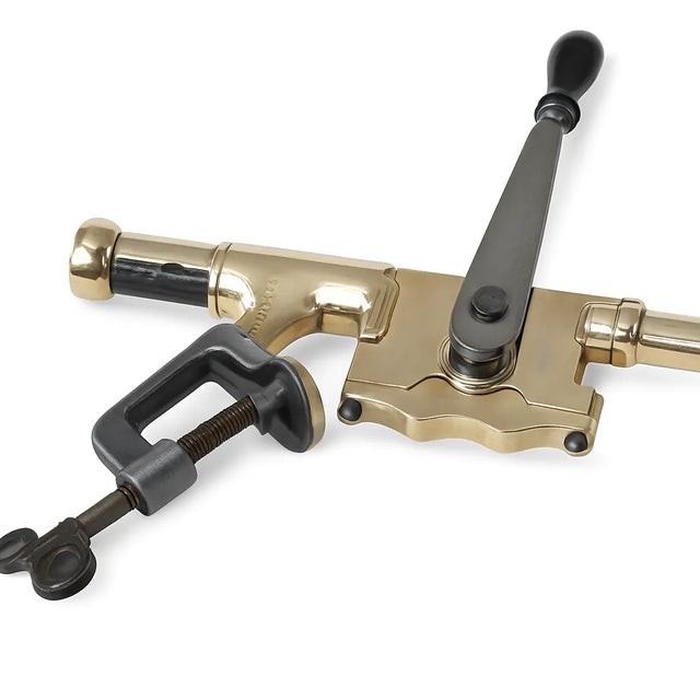 A striking antique brass and iron bar-mount corkscrew, marked “THE ACME.” Dating from the late 19th to early 20th century...