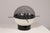 A striking and unique sculptural table lamp by Gaetano Missaglia, Italy, 1970s. The lamp features a composition of various...