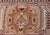 This late 19th Century Indian Amritsar rug features a rectangular field of leaf and floral designs along with curlicue...