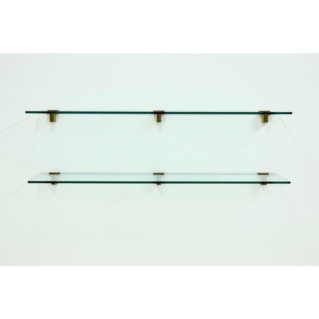 Rare and striking wall-mounted shelving unit designed by Peter Ghyczy in the 1970s. Measuring 186 cm in width, the unit...