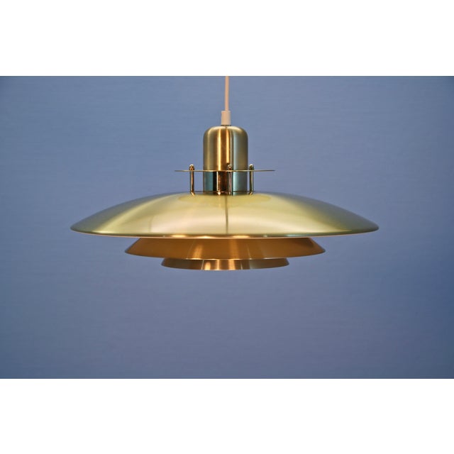 Danish Haning Lamp in Brass, 1980s, in Very Good conditions. Designed 1970 to 1979 Up to 250V (Europe/UK Standard).The...