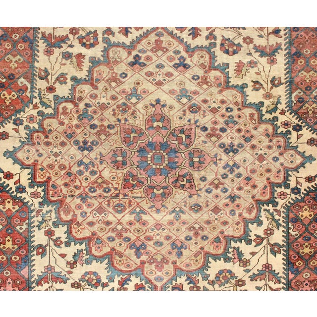 Antique Feraghan Sarouk Rug in Ivory Background, Brown Red, Camel, and Teal For Sale - Image 10 of 13
