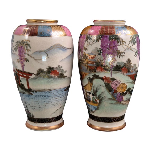 A set of two small Japanese Satsuma vases, preserved together with the original padded fitted box in which they were sold....