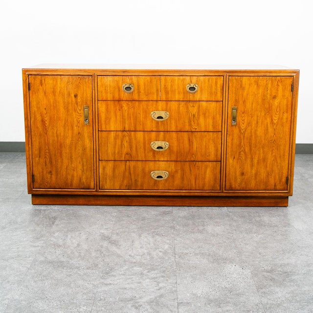 5 drawer Drexel Passage Dresser in brass and wood throughout. Signed within the drawer and on the back. Unique look and...